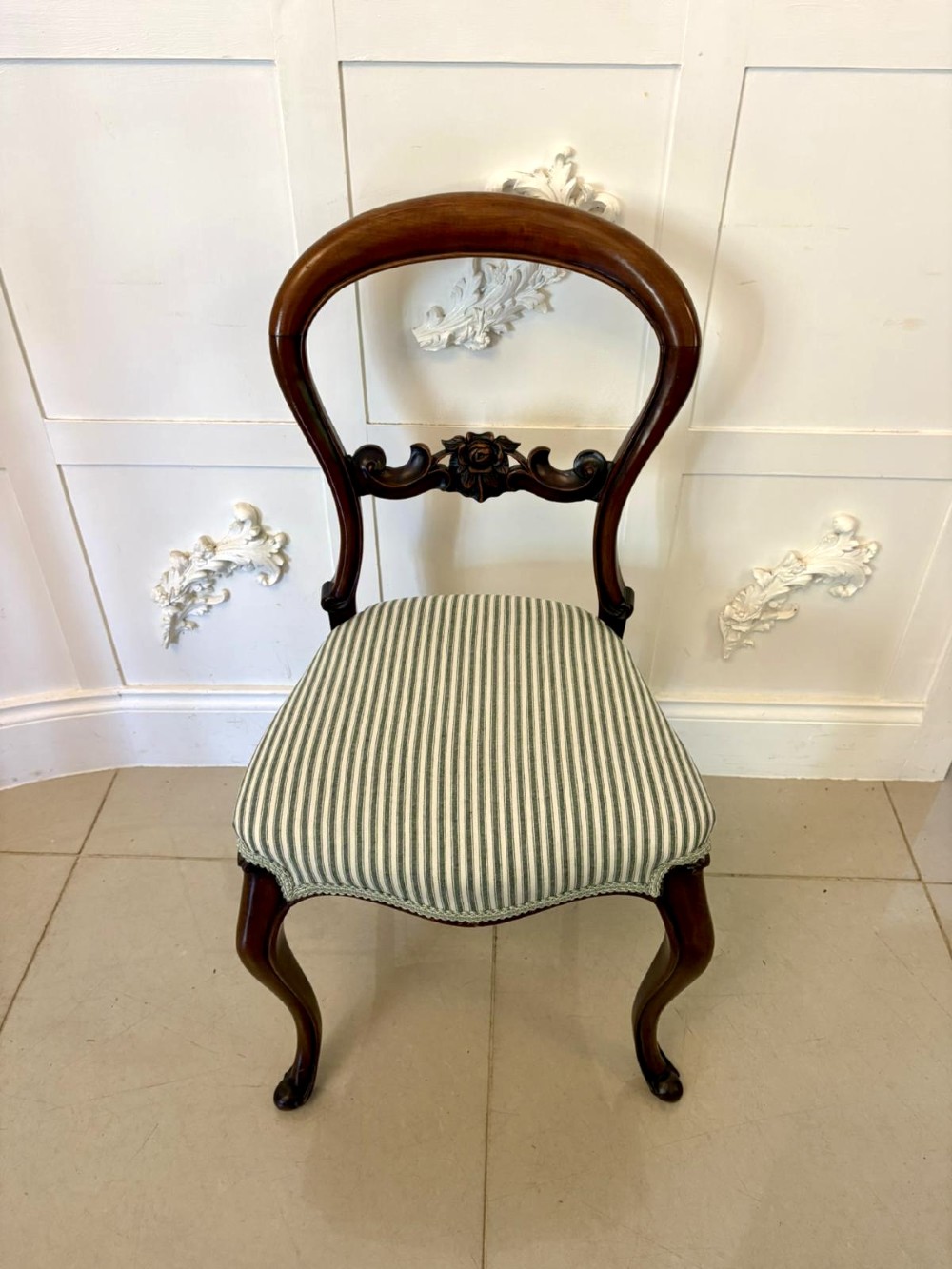 Set of six antique Victorian mahogany dining chairs featuring carved balloon backrests, cabriole front legs, and green-and-white striped fabric seats. View VIII