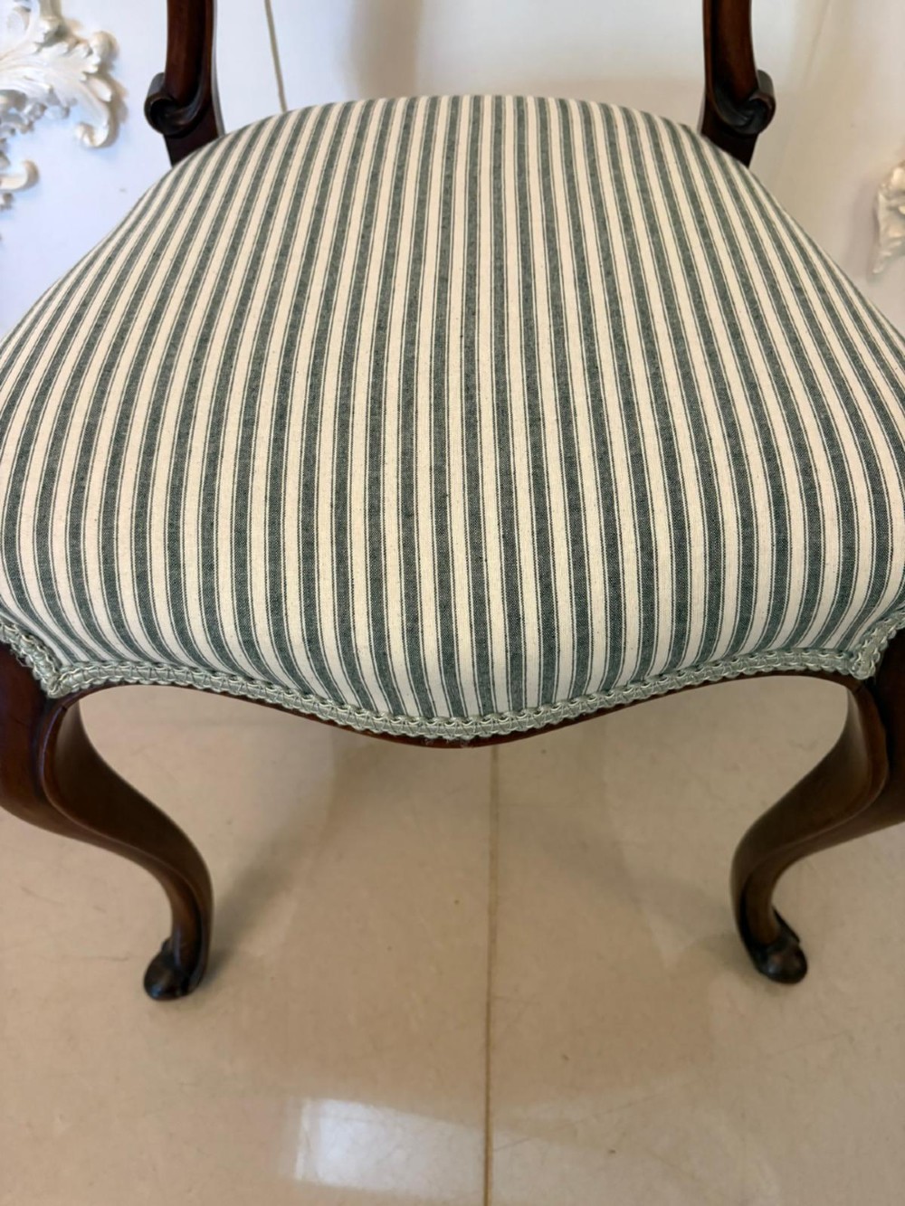 Set of six antique Victorian mahogany dining chairs featuring carved balloon backrests, cabriole front legs, and green-and-white striped fabric seats. View IX
