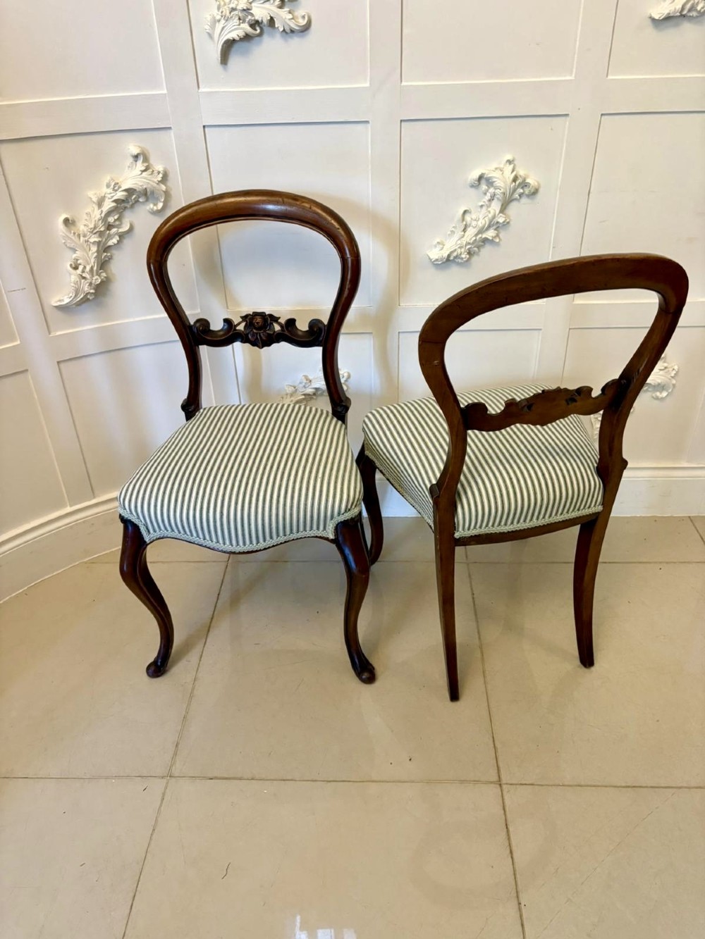 Set of six antique Victorian mahogany dining chairs featuring carved balloon backrests, cabriole front legs, and green-and-white striped fabric seats. View XV