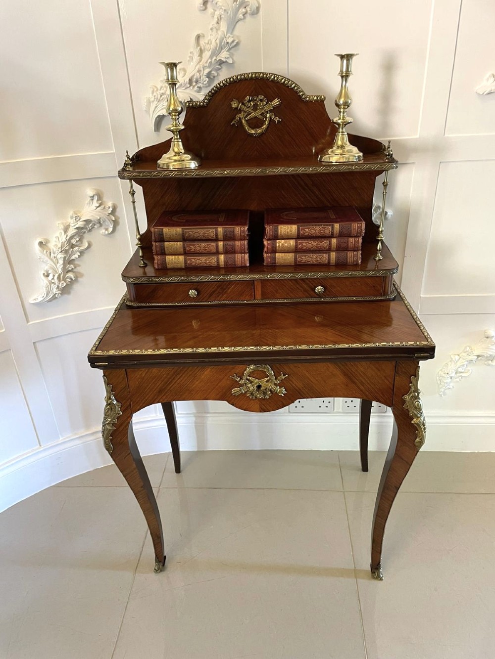 A French kingwood writing desk featuring a stepped upper superstructure with drawers, gilt-bronze mounts, parquetry veneer, and cabriole legs. View VI