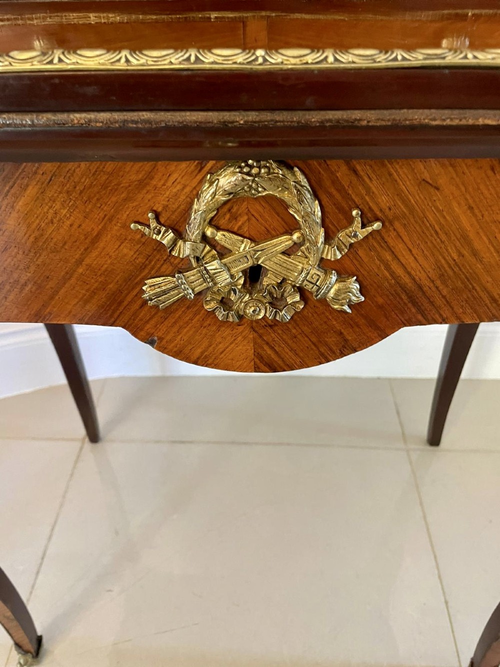 A French kingwood writing desk featuring a stepped upper superstructure with drawers, gilt-bronze mounts, parquetry veneer, and cabriole legs. View VIII