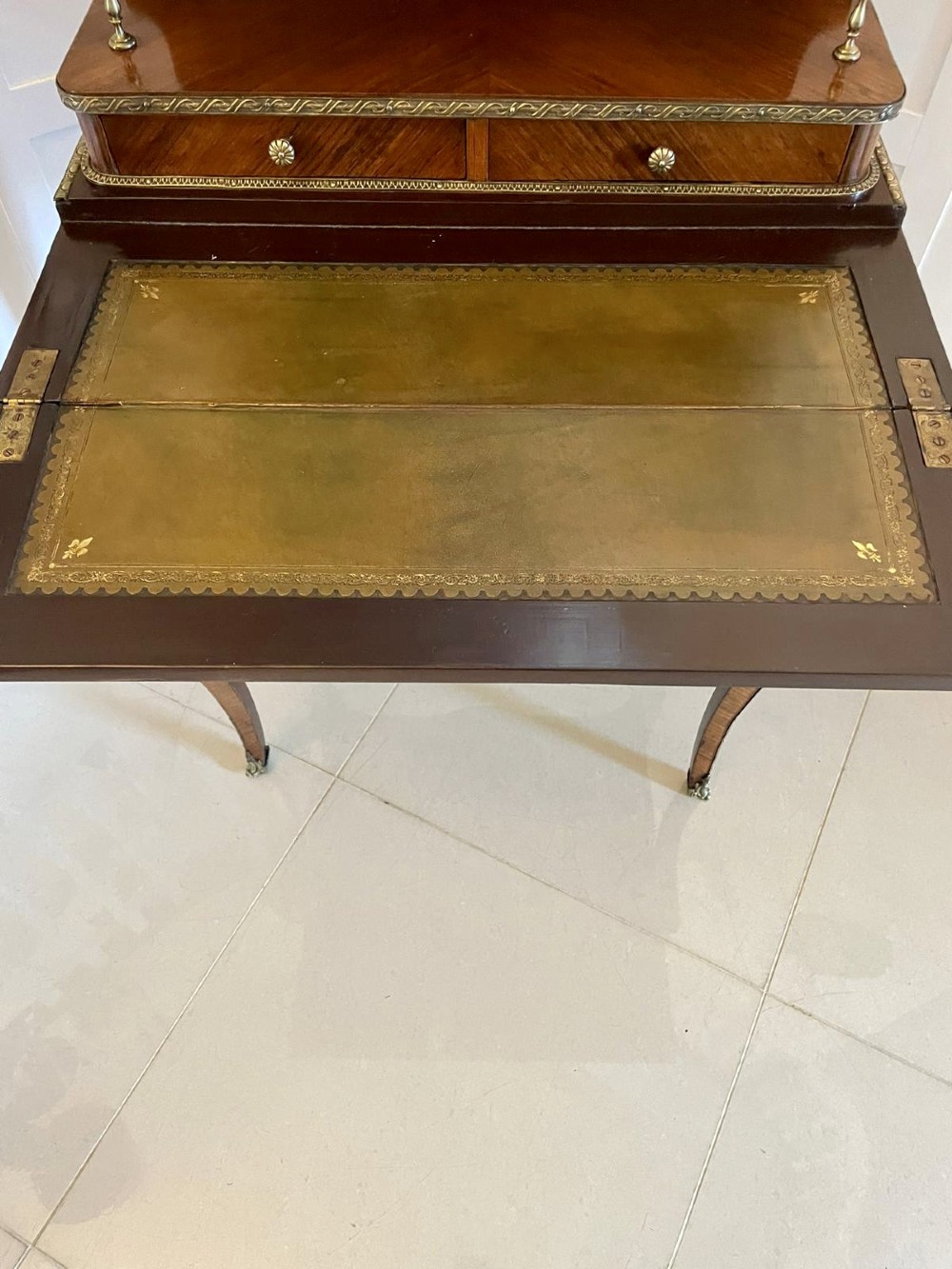 A French kingwood writing desk featuring a stepped upper superstructure with drawers, gilt-bronze mounts, parquetry veneer, and cabriole legs. View X