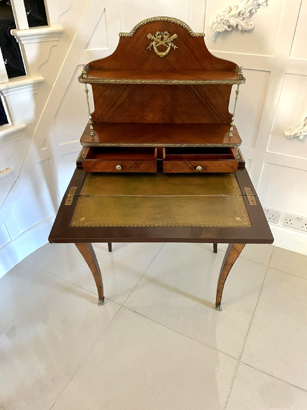 A French kingwood writing desk featuring a stepped upper superstructure with drawers, gilt-bronze mounts, parquetry veneer, and cabriole legs. View XI