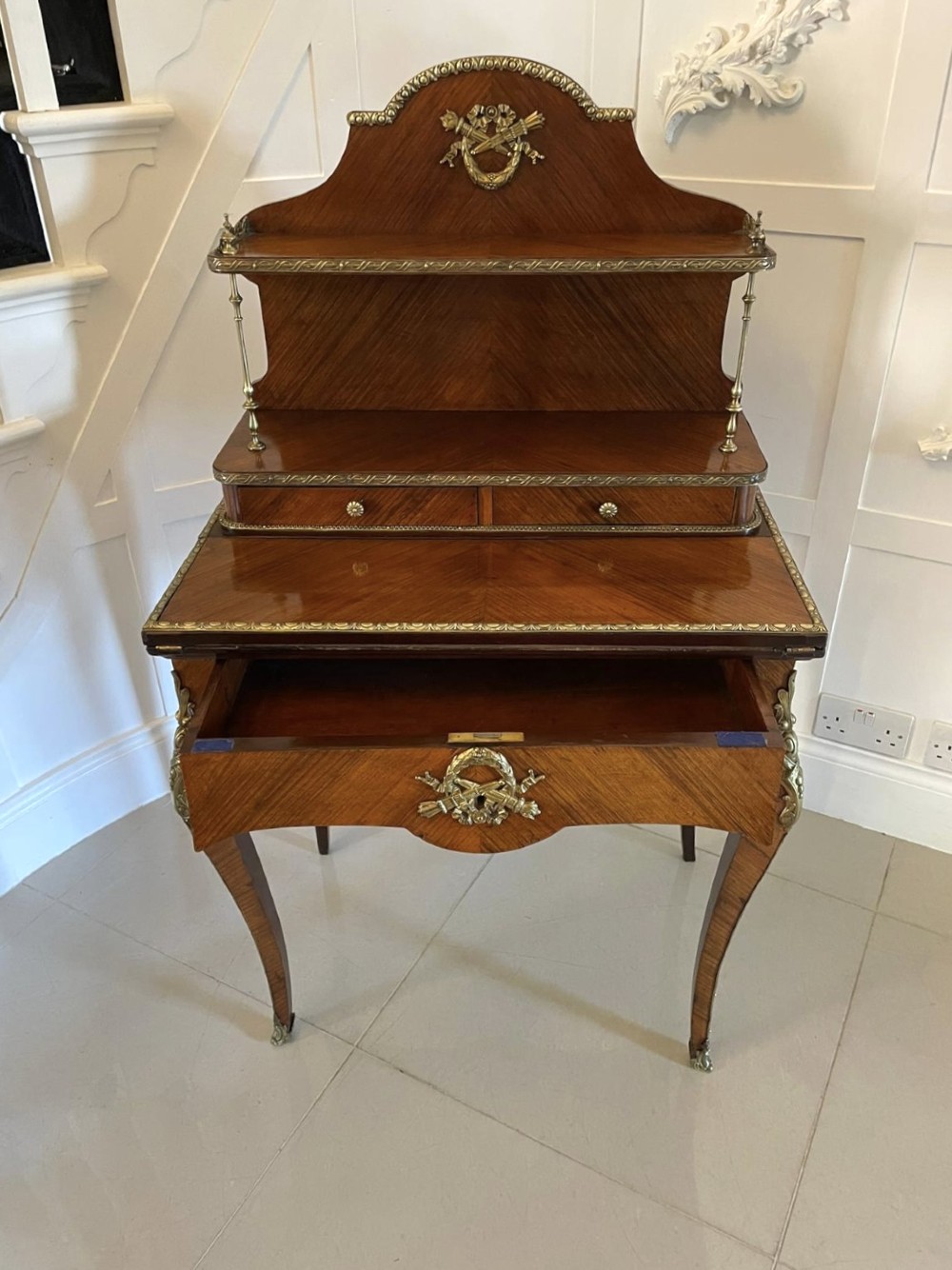 A French kingwood writing desk featuring a stepped upper superstructure with drawers, gilt-bronze mounts, parquetry veneer, and cabriole legs. View XII