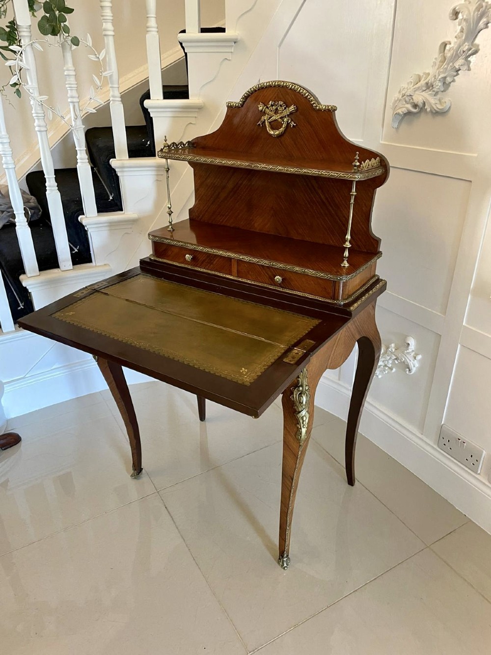 A French kingwood writing desk featuring a stepped upper superstructure with drawers, gilt-bronze mounts, parquetry veneer, and cabriole legs. View XIV