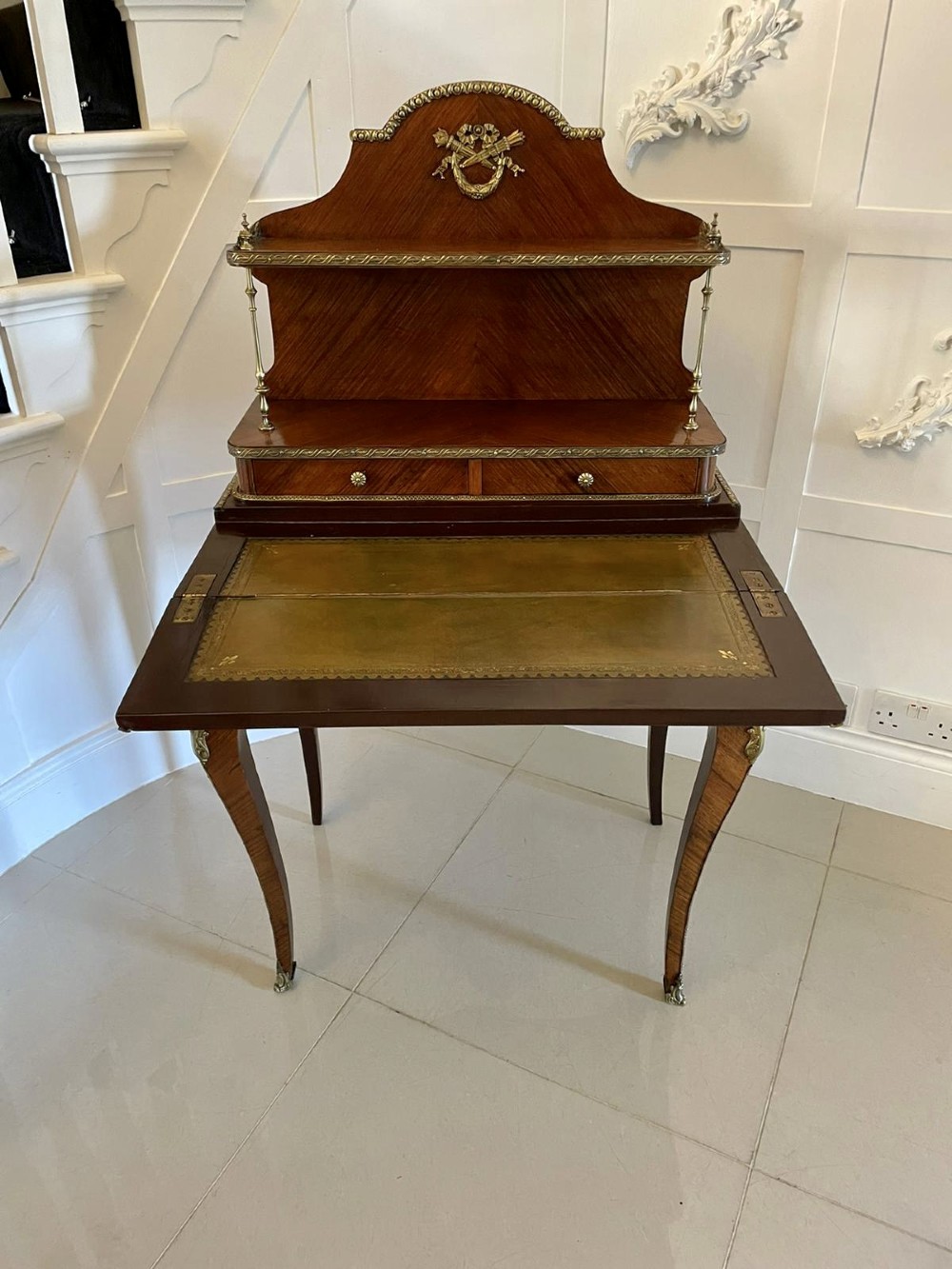 A French kingwood writing desk featuring a stepped upper superstructure with drawers, gilt-bronze mounts, parquetry veneer, and cabriole legs. View XV