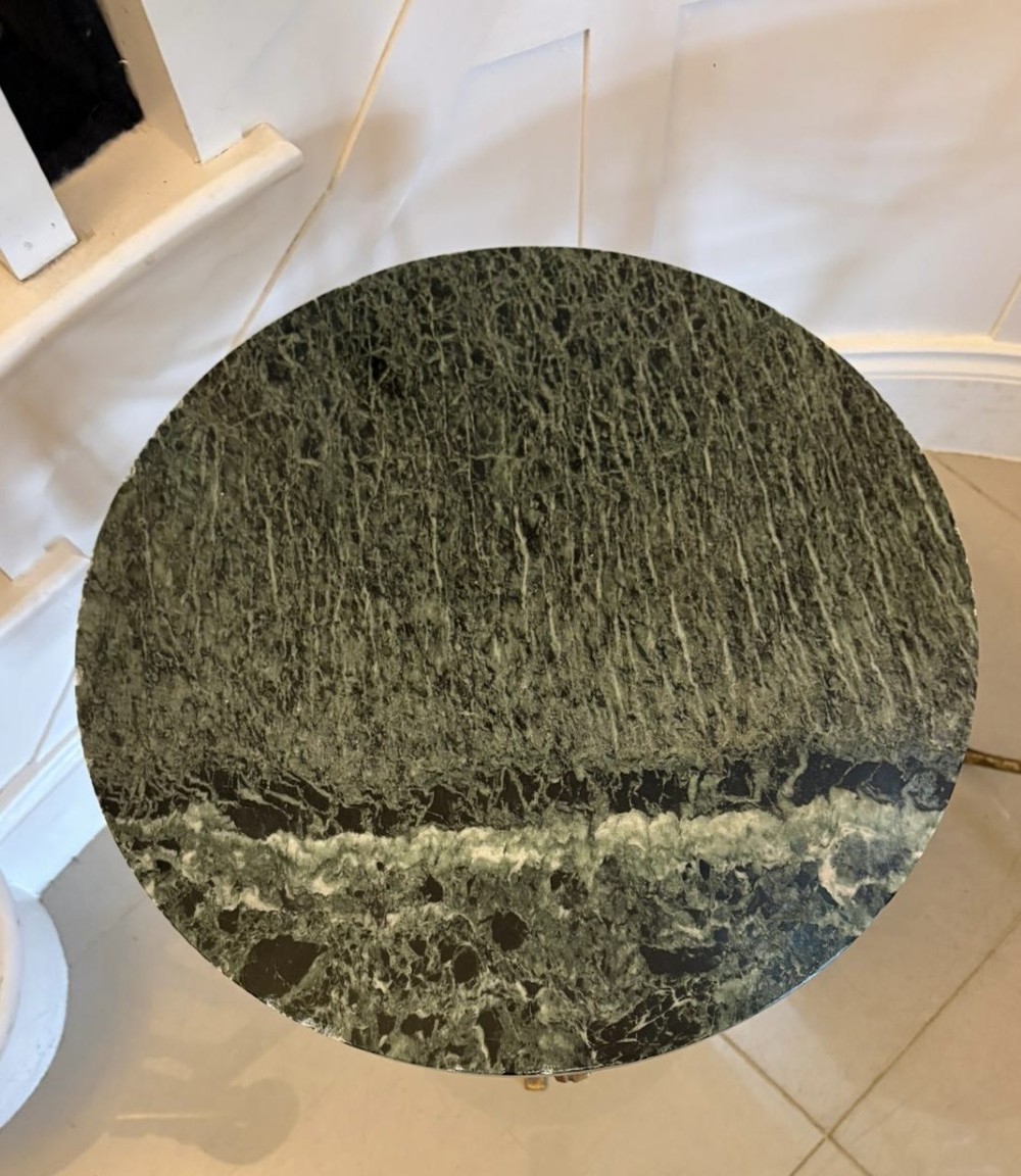 A pair of circular Italian side tables featuring dark green marble tops supported by gilt metal legs adorned with draped rope and tassel motifs. View VII