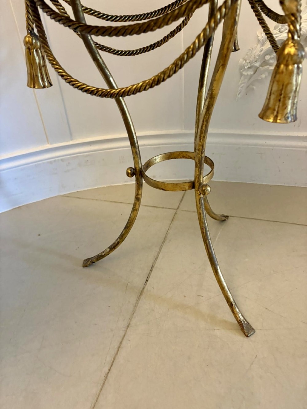 A pair of circular Italian side tables featuring dark green marble tops supported by gilt metal legs adorned with draped rope and tassel motifs. View VIII
