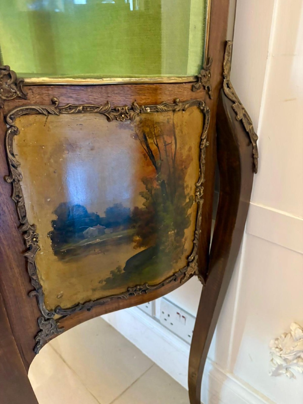 A French Louis XV Revival Vernis Martin vitrine cabinet featuring bowed glass doors, gilt bronze mounts, painted lower panels depicting figures, and a fabric-lined interior. View IV