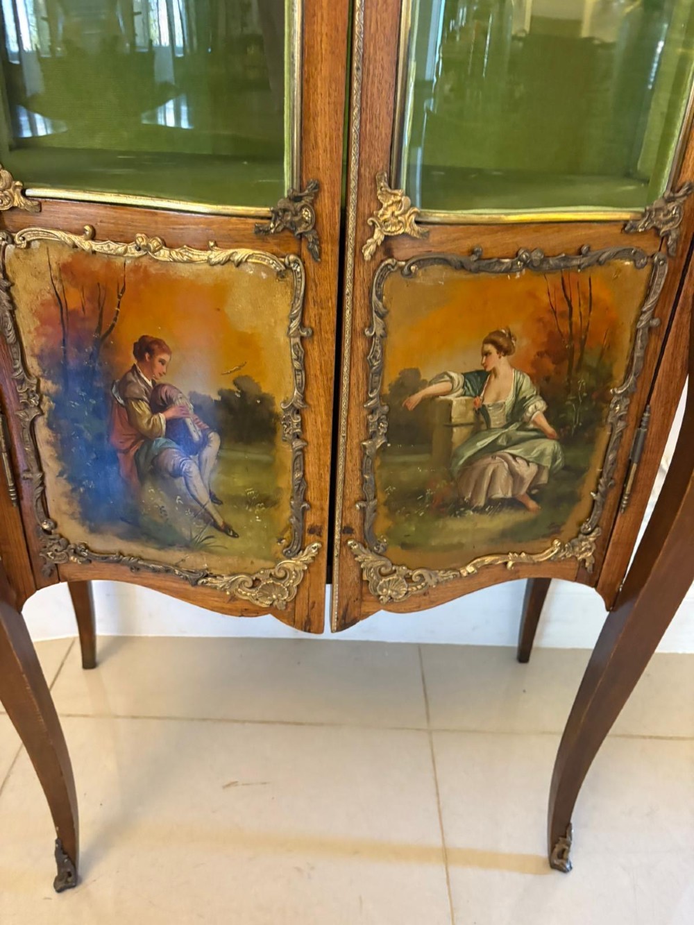 A French Louis XV Revival Vernis Martin vitrine cabinet featuring bowed glass doors, gilt bronze mounts, painted lower panels depicting figures, and a fabric-lined interior. View IX