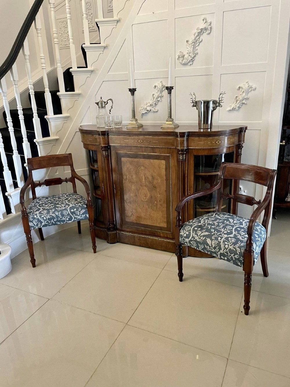 A Victorian burr walnut credenza with a central marquetry inlaid door, gilt ormolu mounts, and two curved glass side display cabinets. View VIII