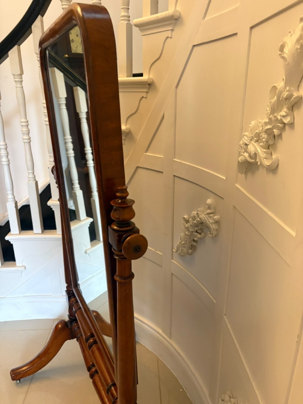A Victorian mahogany freestanding cheval mirror featuring turned upright pillars, arched legs, and a swivelling full-length mirror frame. View VIII