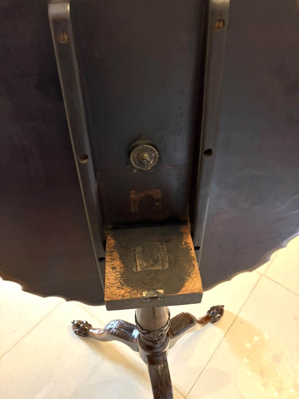 A mahogany George III style tilt-top centre table featuring a scalloped piecrust edge, central pedestal, and tripod cabriole legs with claw and ball feet. View X
