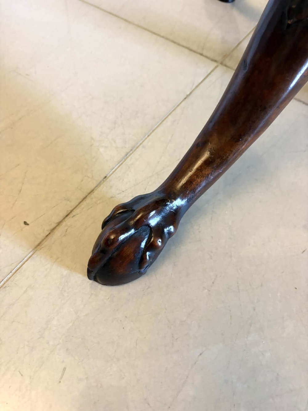 A mahogany George III style tilt-top centre table featuring a scalloped piecrust edge, central pedestal, and tripod cabriole legs with claw and ball feet. View XI
