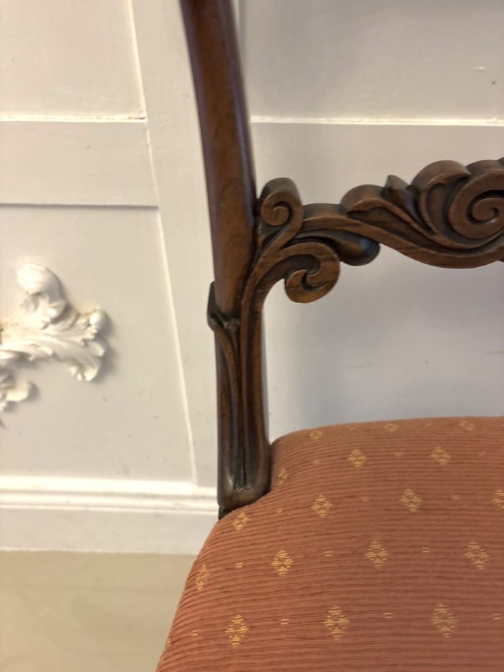 A set of four antique Regency rosewood dining chairs featuring carved scroll top rails and pattern-upholstered seats on turned front legs. View VII
