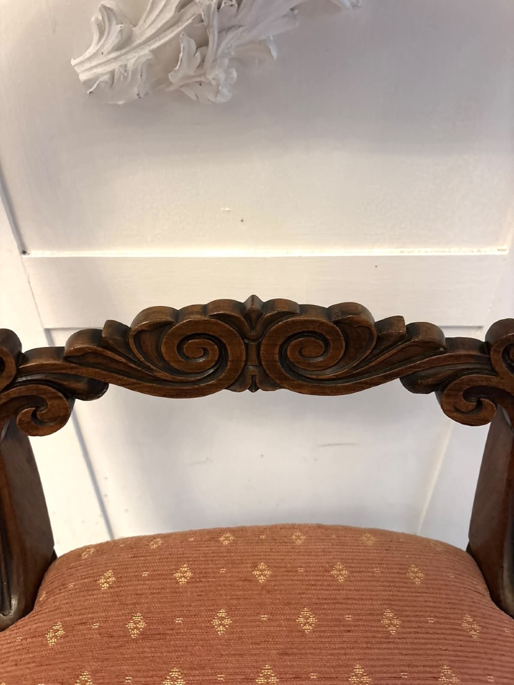 A set of four antique Regency rosewood dining chairs featuring carved scroll top rails and pattern-upholstered seats on turned front legs. View VIII