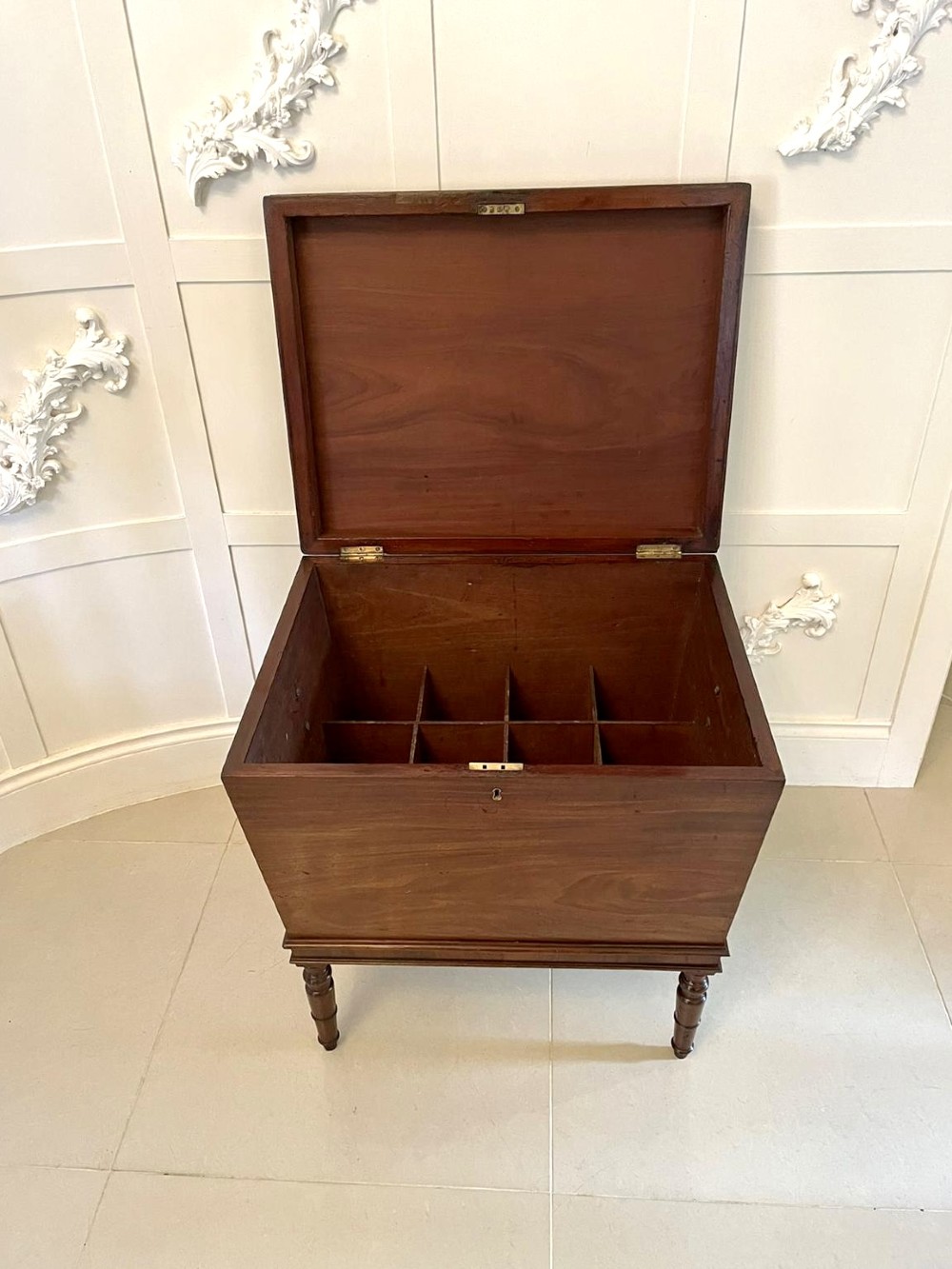 A Georgian mahogany cellarette featuring a tapered rectangular body on turned legs with brass lion-mask side handles and a keyhole lid. View XIV
