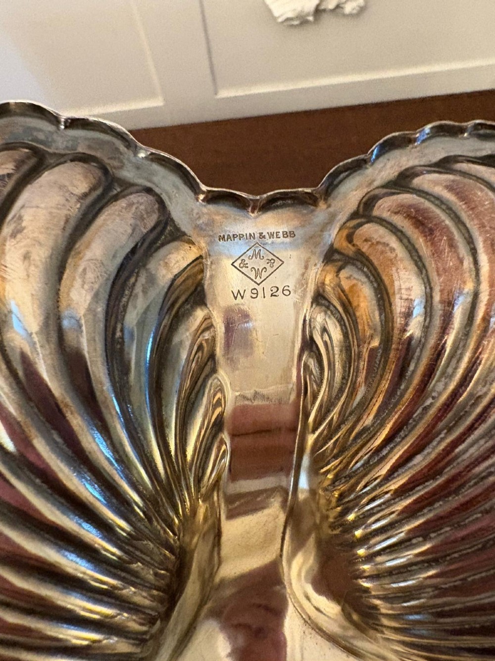 An Edwardian silver-plated tripartite serving dish featuring three fluted shell-shaped compartments joined by a central twisted handle. View III