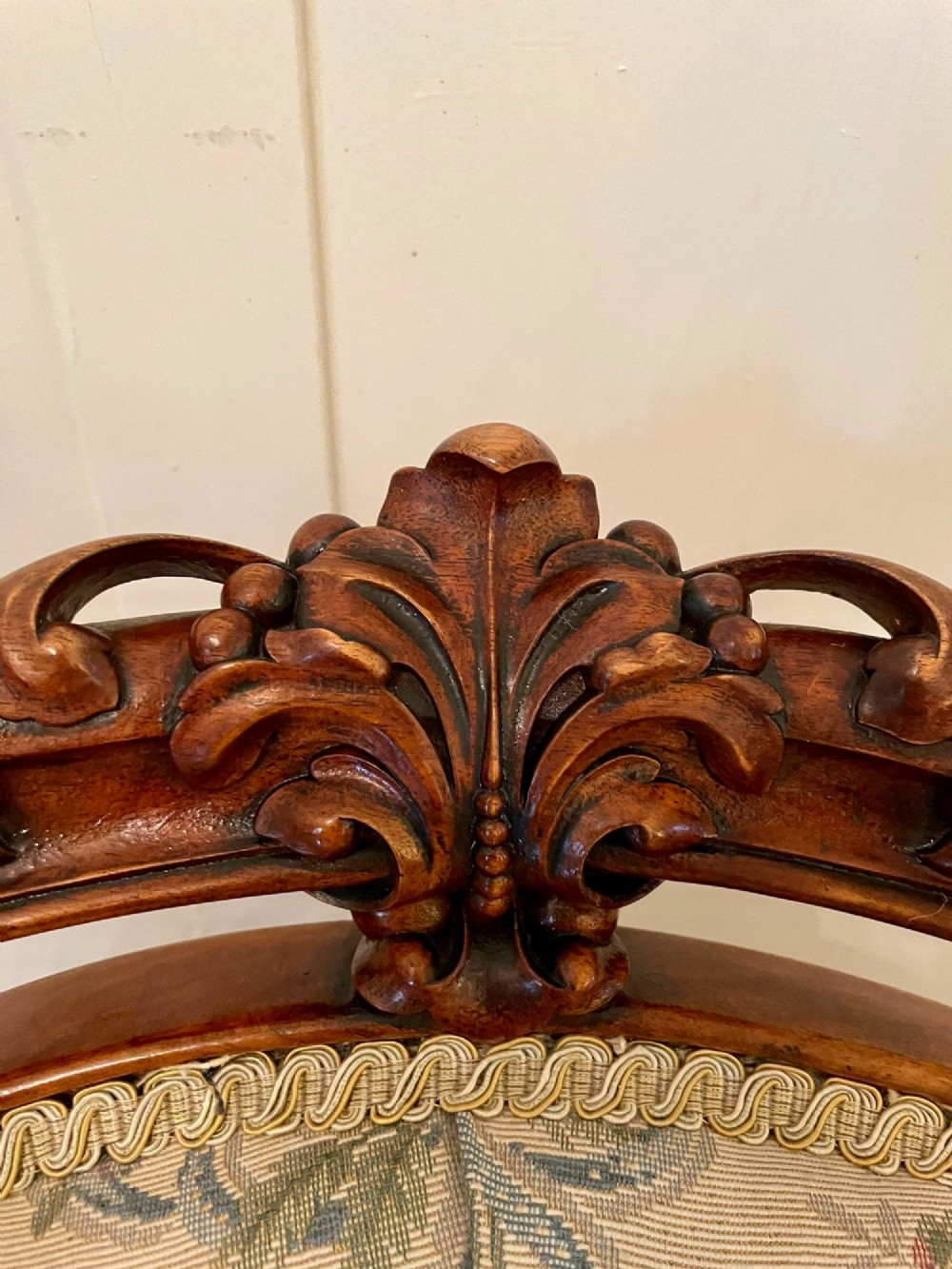 A pair of Victorian carved walnut side chairs featuring button-tufted floral upholstery and cabriole legs with ceramic castors. View XIII
