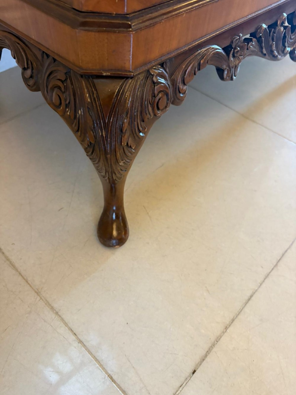 An antique burr walnut cocktail cabinet featuring two upper doors with ornate brass hardware, set on carved cabriole legs. View III