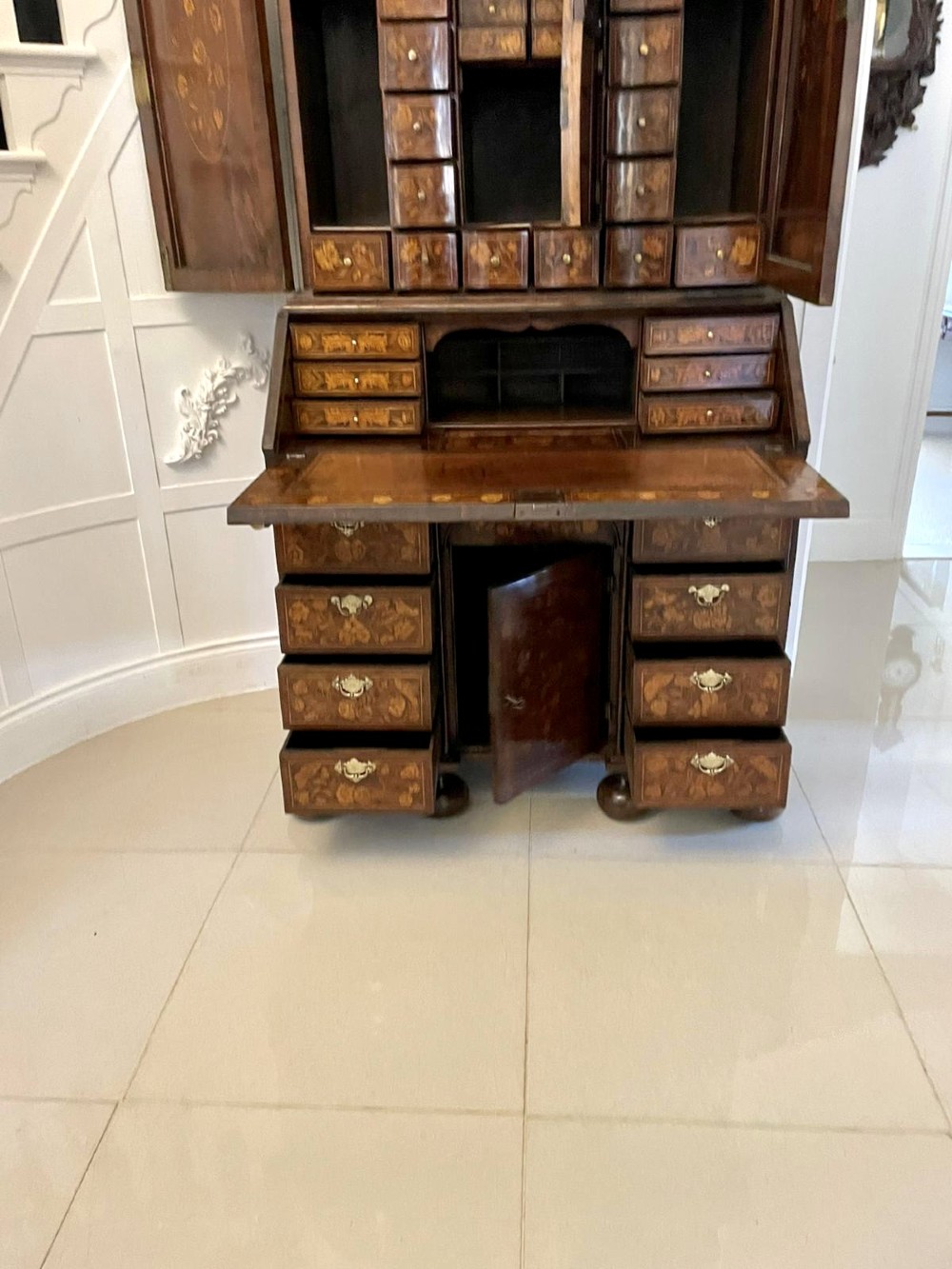 An antique William and Mary double-dome bureau bookcase crafted from burr walnut with intricate floral marquetry inlay and ball feet. View VI