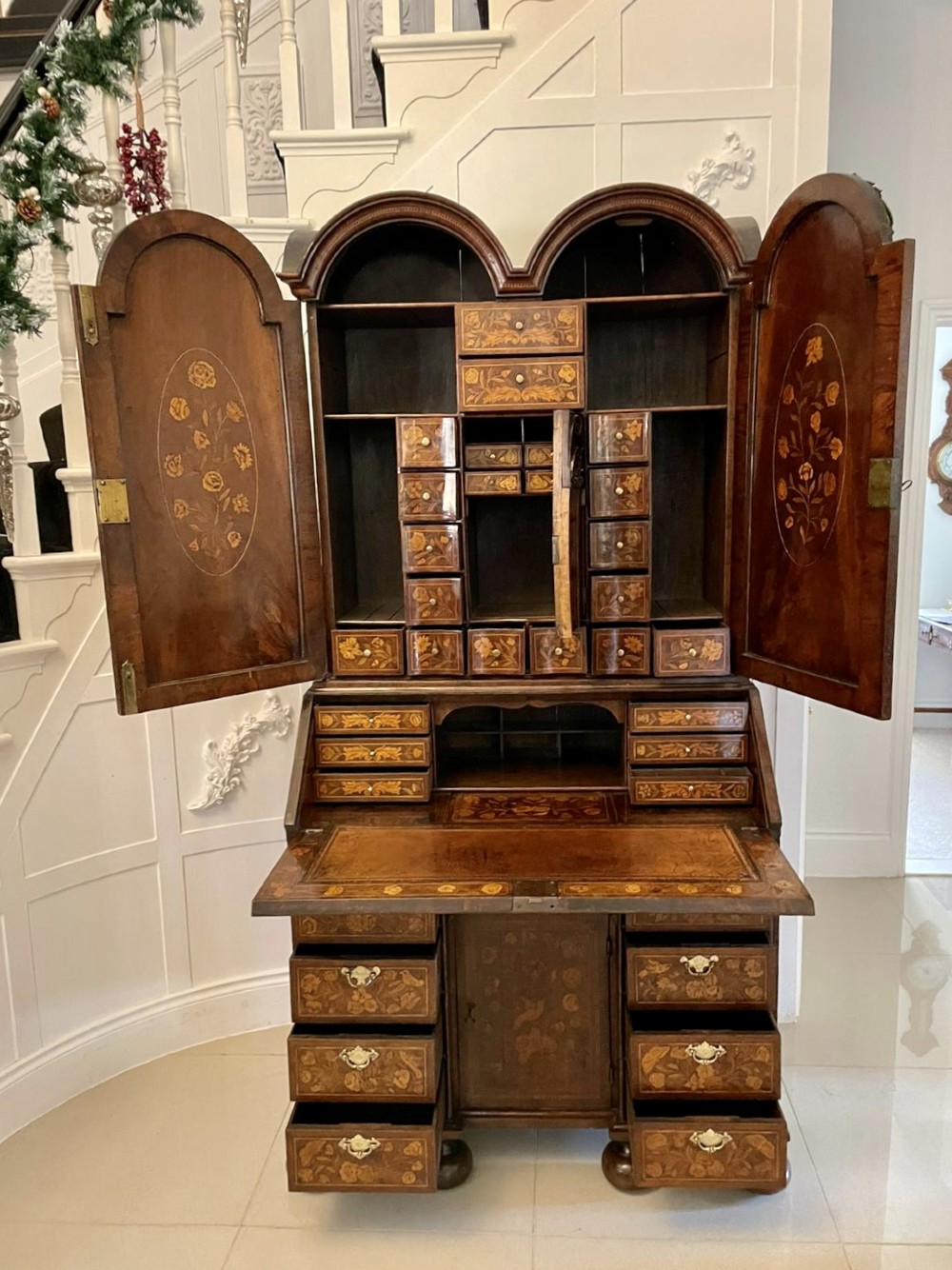 An antique William and Mary double-dome bureau bookcase crafted from burr walnut with intricate floral marquetry inlay and ball feet. View VII