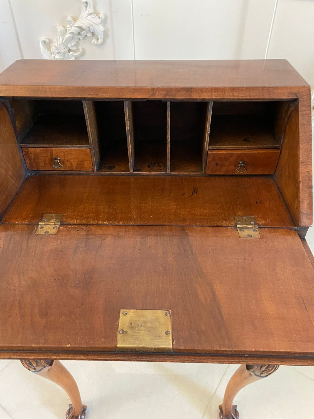 An antique burr walnut slant-front bureau featuring central floral marquetry inlay, two drawers, and carved cabriole legs with claw and ball feet. View III