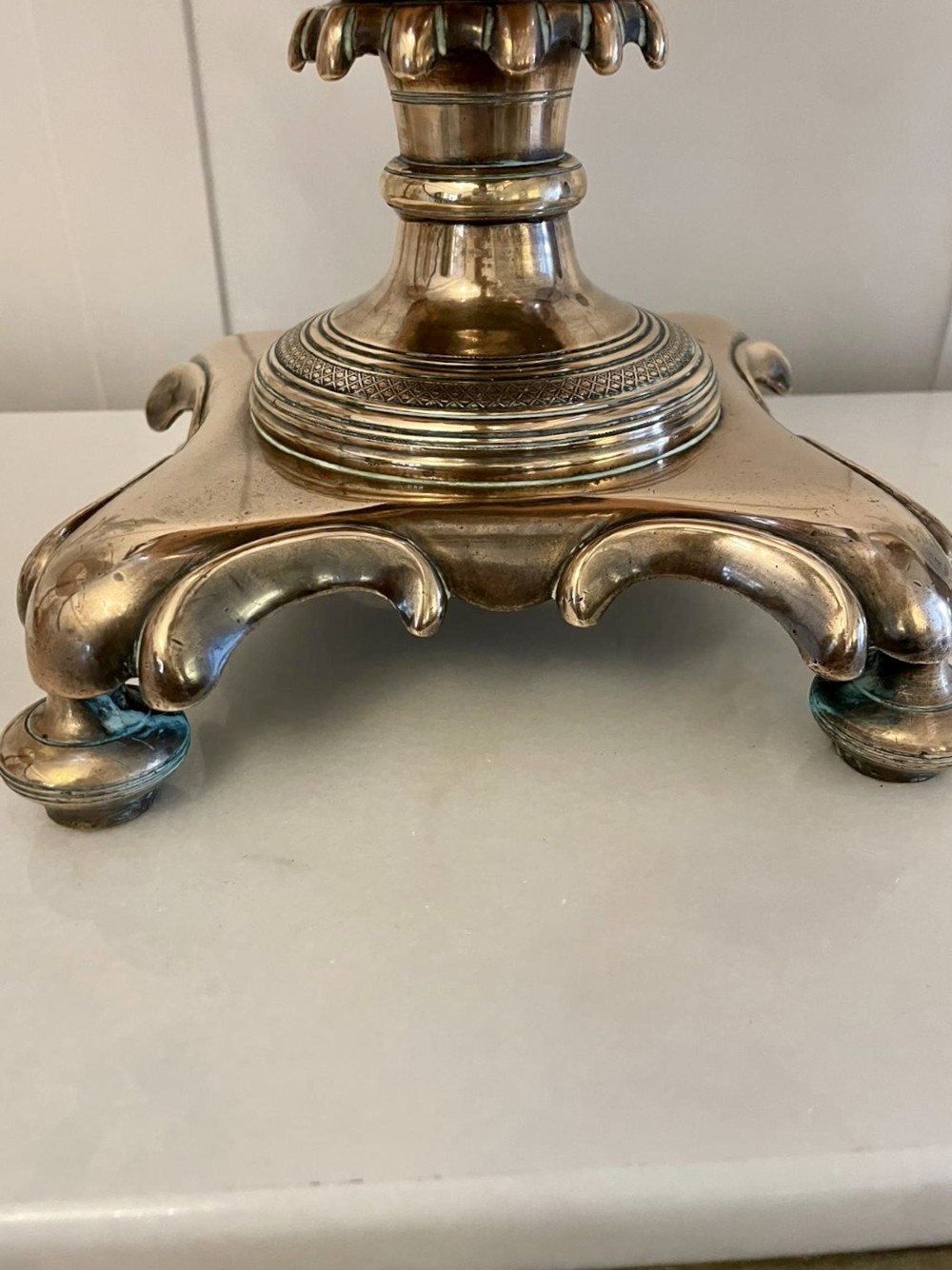 An antique Victorian polished copper and brass samovar featuring cast scrolling handles, a fluted top lid, a front tap, and a stepped square base. View V