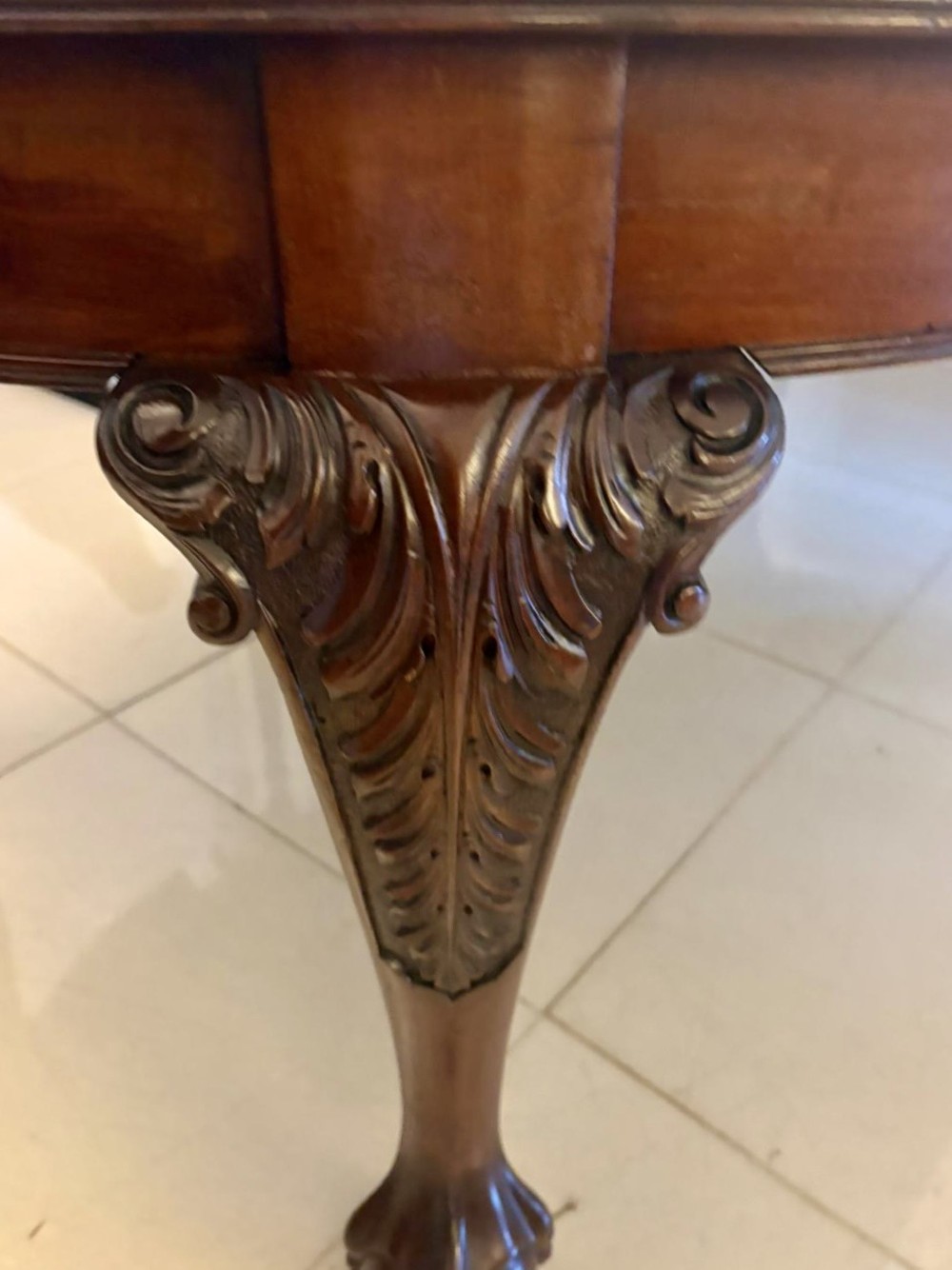 A large Victorian extending mahogany dining table featuring rounded ends and hand-carved cabriole legs with ball and claw feet. View IX