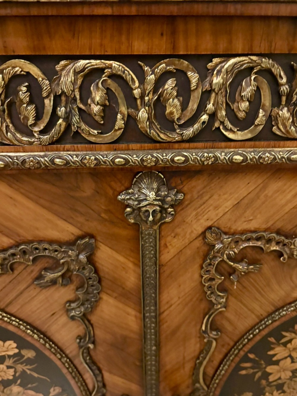 A French Louis XVI style wooden side cabinet featuring a white marble top, gilt-bronze mounts, and two door panels decorated with floral marquetry. View III