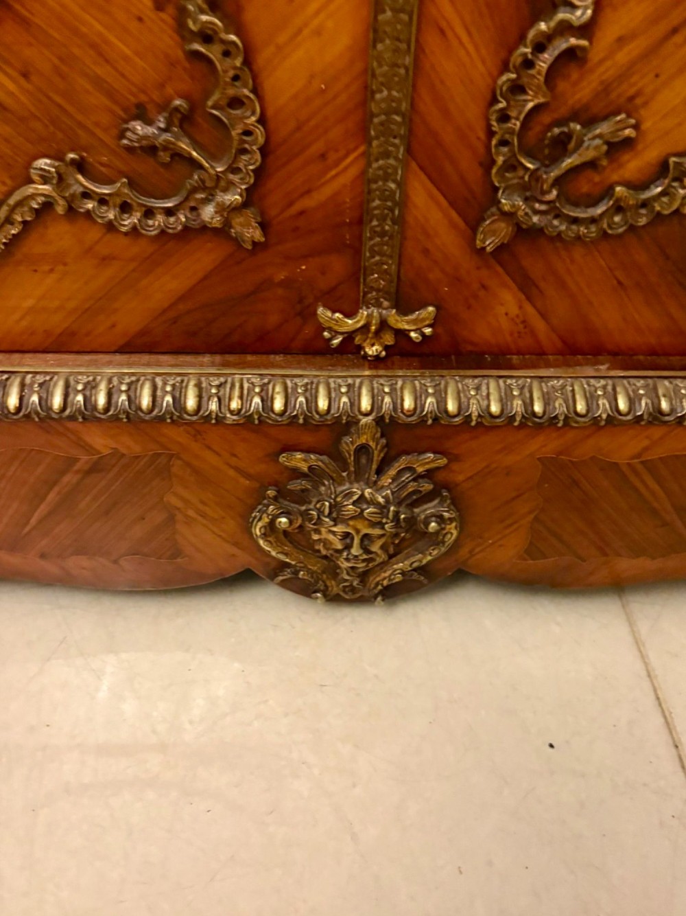 A French Louis XVI style wooden side cabinet featuring a white marble top, gilt-bronze mounts, and two door panels decorated with floral marquetry. View VI