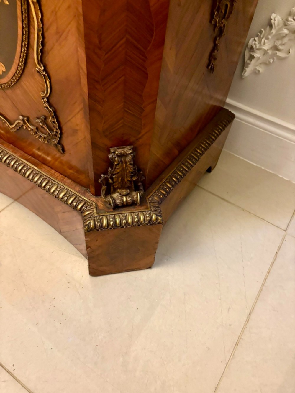 A French Louis XVI style wooden side cabinet featuring a white marble top, gilt-bronze mounts, and two door panels decorated with floral marquetry. View VIII