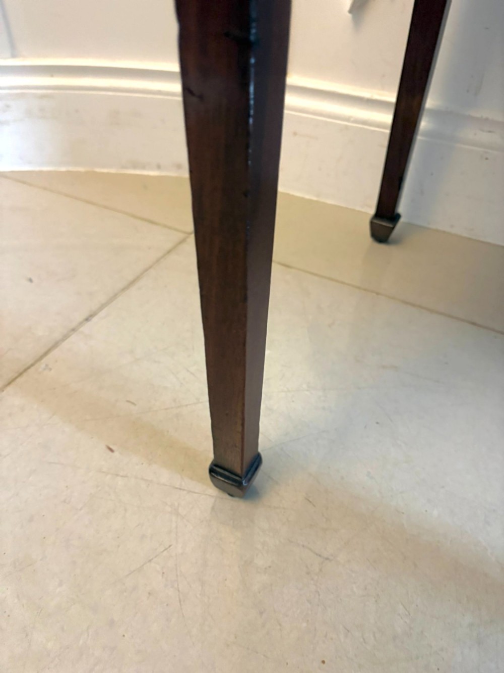 An antique Georgian mahogany lowboy hall table featuring three drawers with brass swan-neck handles and straight square legs. View XI