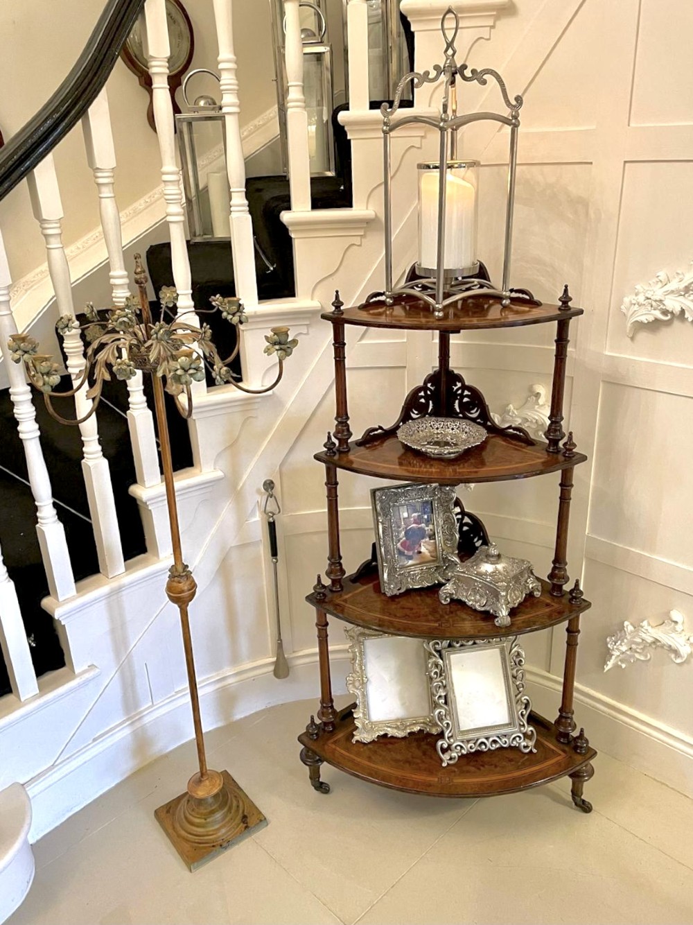A four-tiered Victorian corner whatnot made of figured burr walnut featuring marquetry inlay, turned columns, and pierced fretwork crests. View III