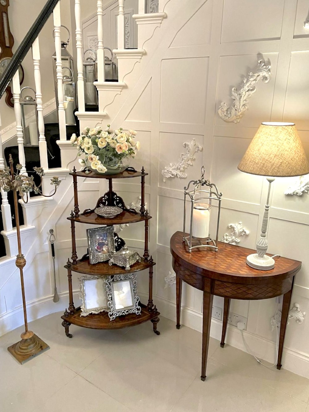 A four-tiered Victorian corner whatnot made of figured burr walnut featuring marquetry inlay, turned columns, and pierced fretwork crests. View XV