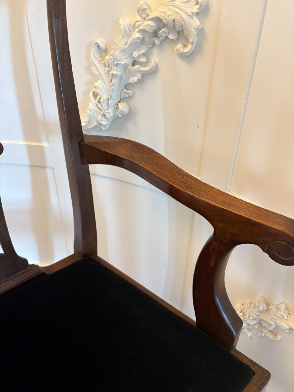 A set of eight Edwardian mahogany dining chairs featuring pierced fretwork splats and black velvet upholstered seats, comprising two carver armchairs and six side chairs. View II
