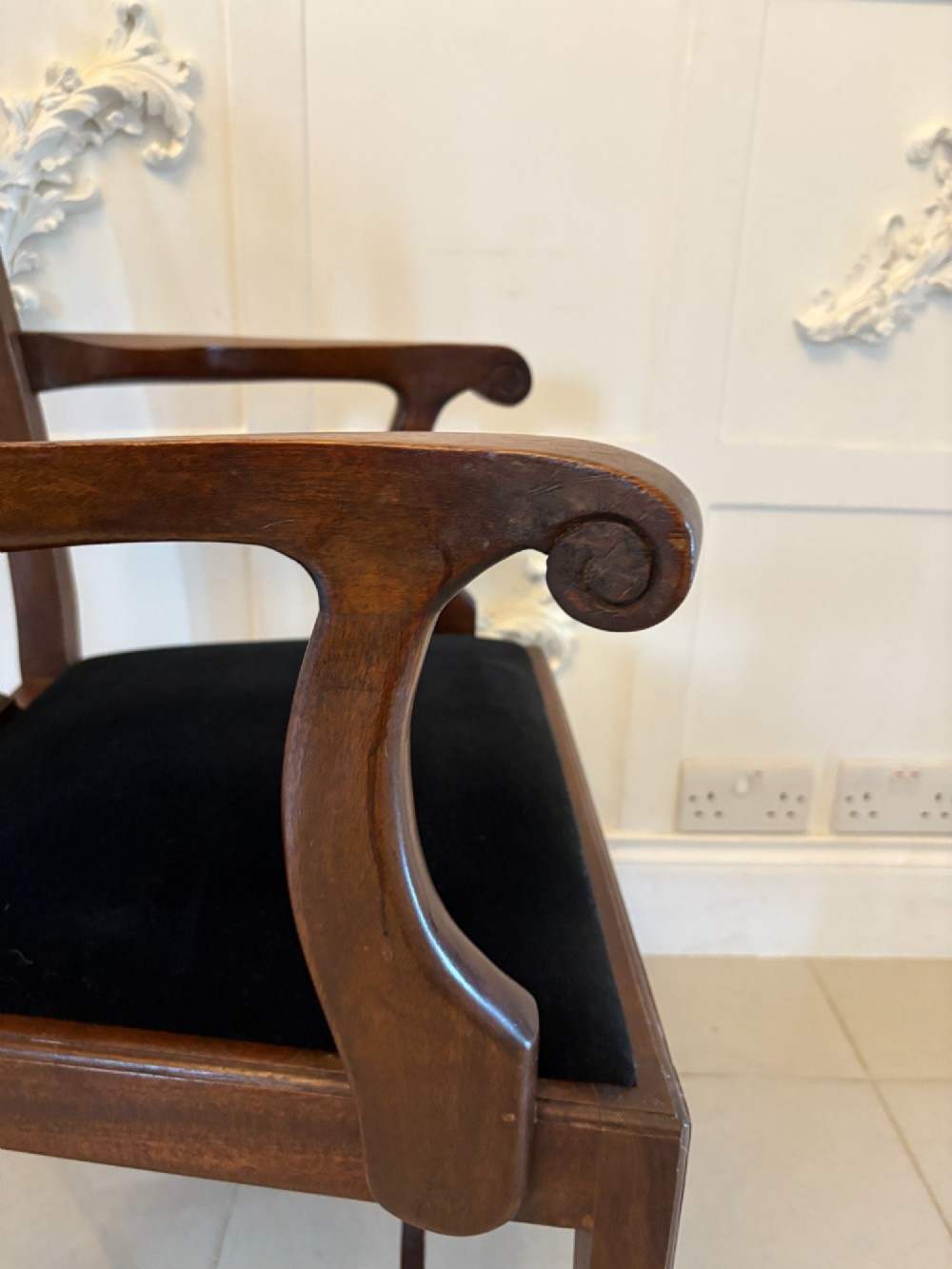 A set of eight Edwardian mahogany dining chairs featuring pierced fretwork splats and black velvet upholstered seats, comprising two carver armchairs and six side chairs. View III