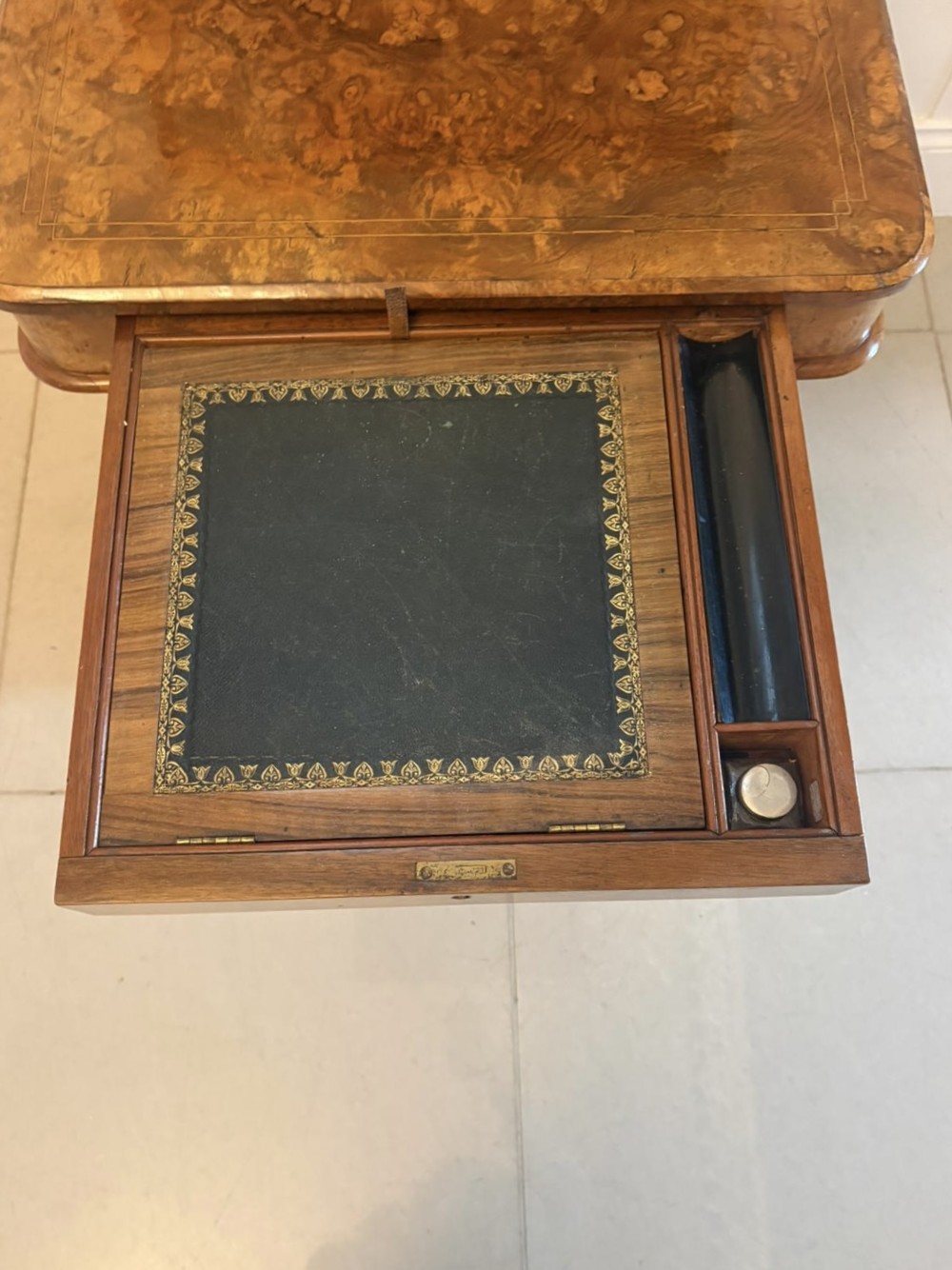 A Victorian burr walnut Davenport desk with floral marquetry inlay, a brass top gallery, and carved scroll feet. View VIII
