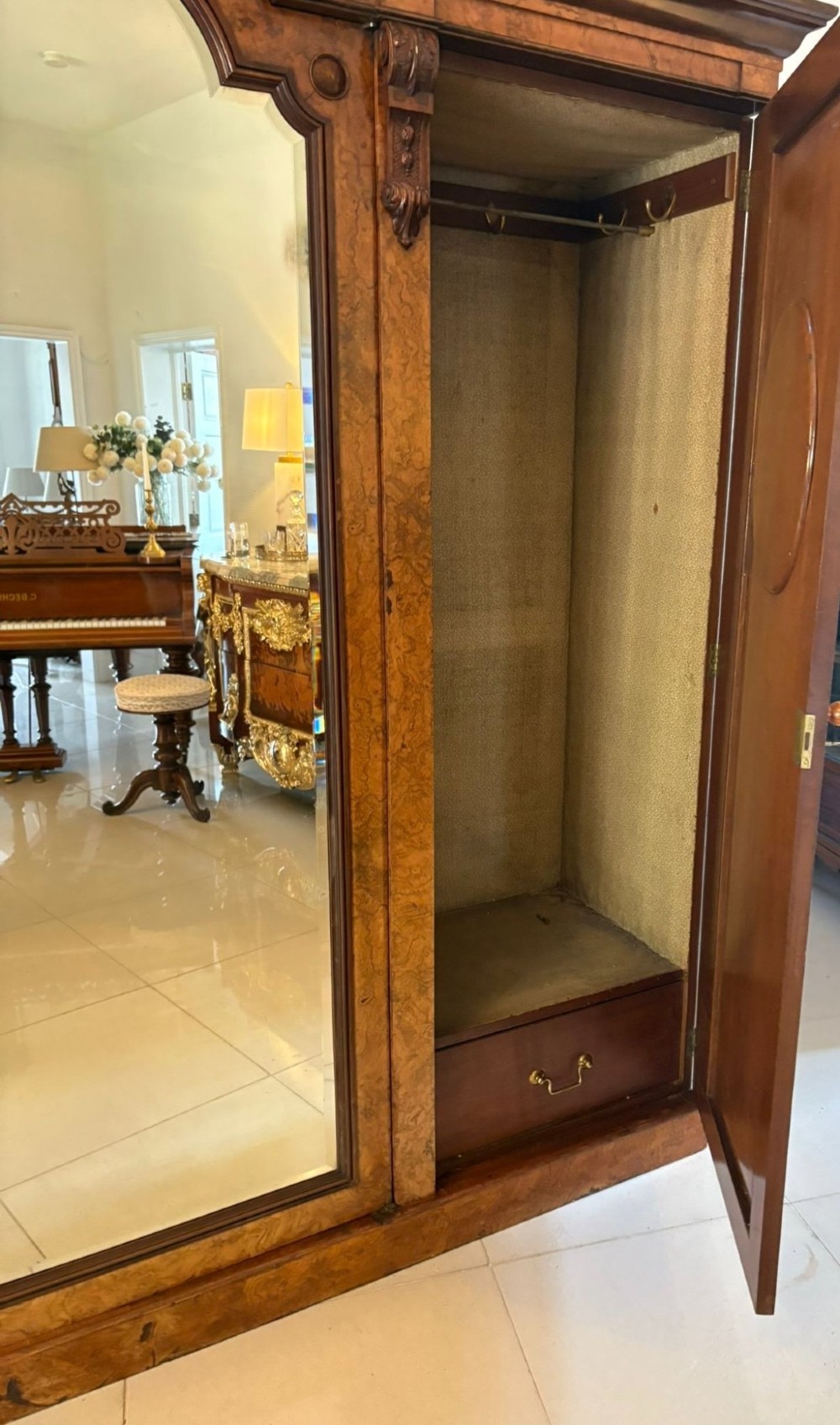 A large Victorian burr walnut three-door wardrobe with a central arched mirrored door, oval mirrors set into side panels, and carved pediment details. View II