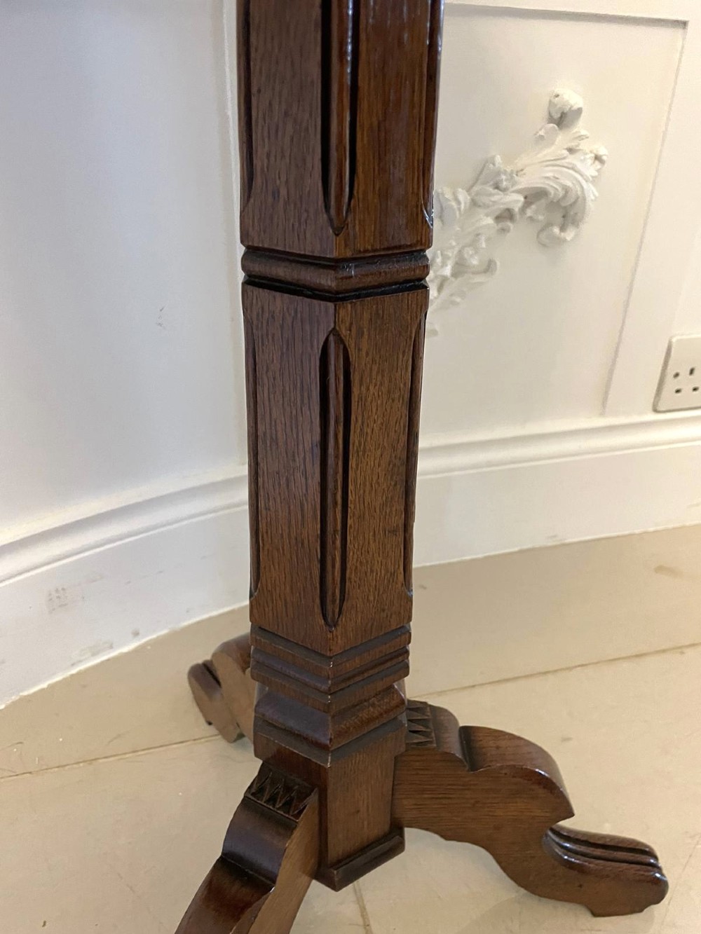 A Victorian octagonal oak lamp table featuring a central star marquetry inlay, a faceted pedestal column, and three carved tripod legs. View VIII