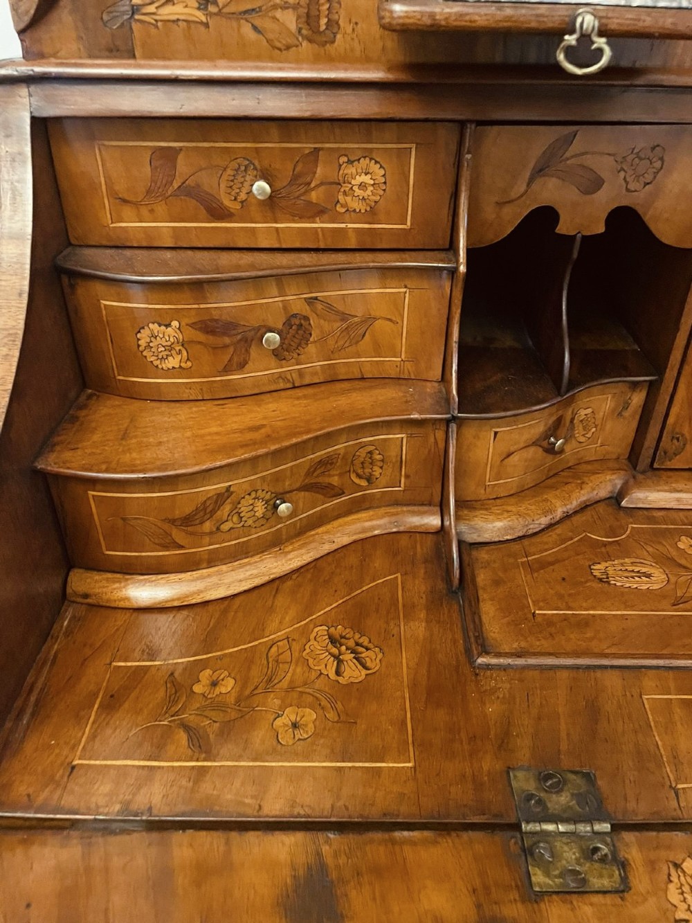 An 18th-century Dutch burr walnut bureau bookcase featuring intricate floral marquetry, a bombe lower drawer section, a fall-front desk slope, and an arched twin-door upper cabinet supported on claw feet. View XII