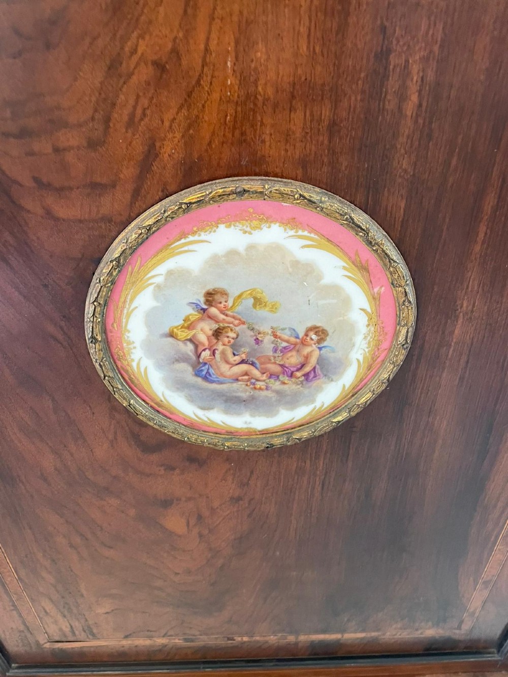 A Victorian dark walnut floor-standing corner cabinet featuring fine marquetry inlay and a central oval hand-painted porcelain plaque. View IV