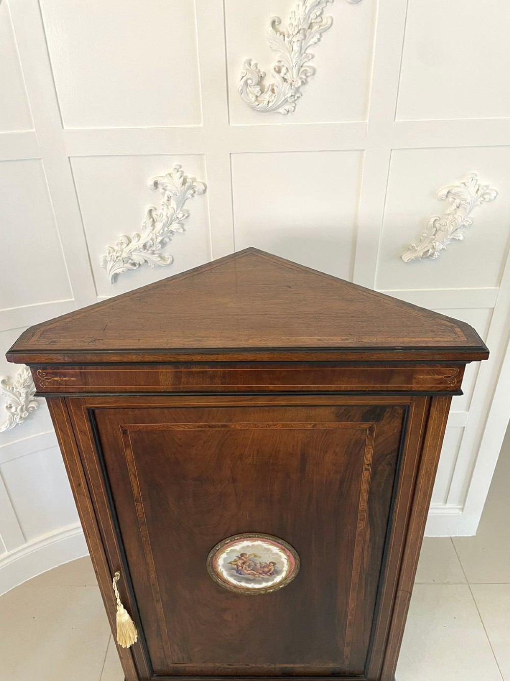 A Victorian dark walnut floor-standing corner cabinet featuring fine marquetry inlay and a central oval hand-painted porcelain plaque. View VI