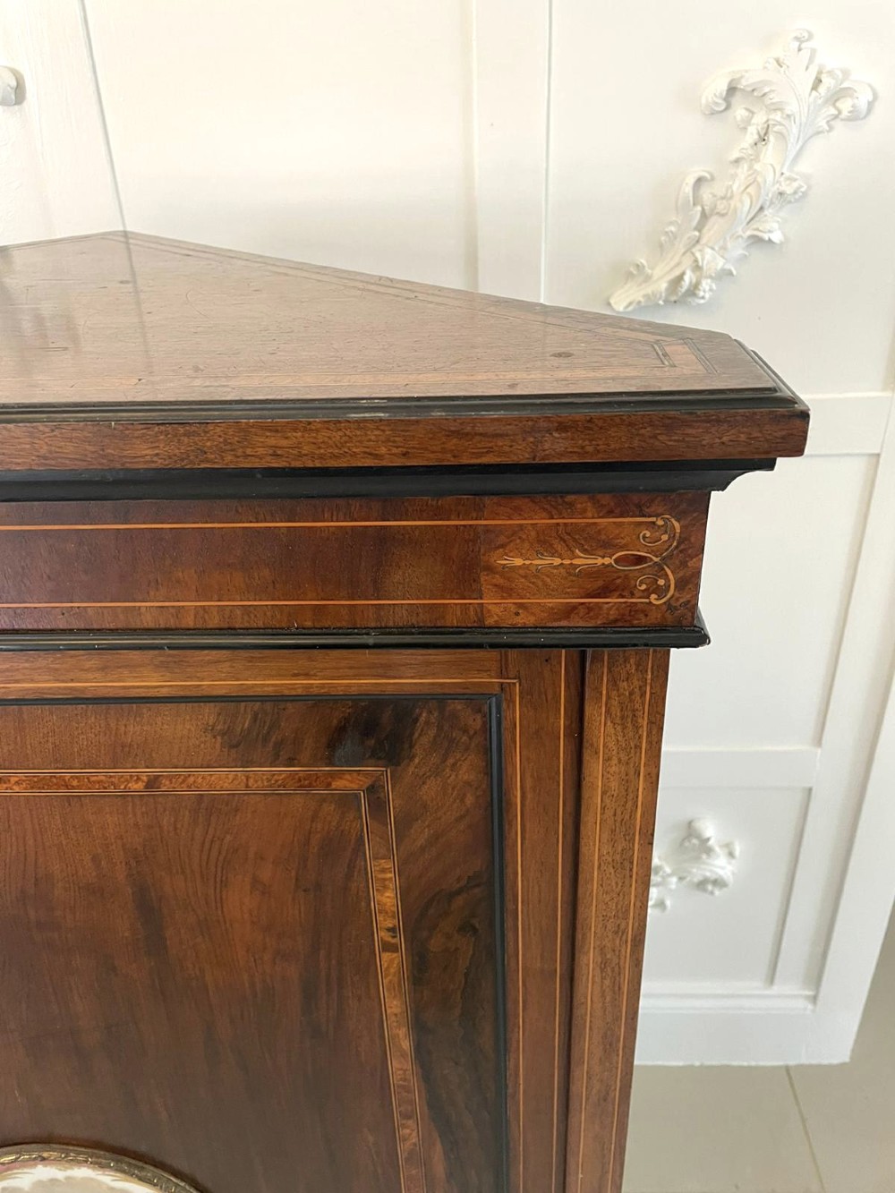 A Victorian dark walnut floor-standing corner cabinet featuring fine marquetry inlay and a central oval hand-painted porcelain plaque. View X