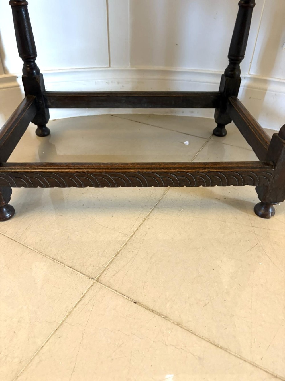 An 18th-century dark oak side table featuring a carved frieze drawer, turned legs, and a rectangular stretcher base. View III