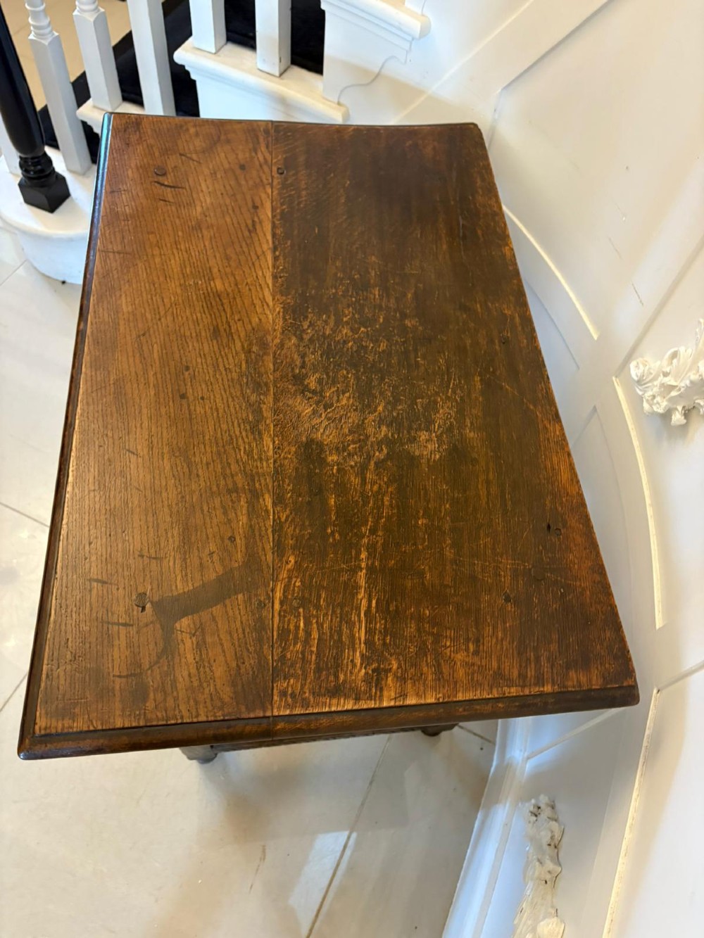 An 18th-century dark oak side table featuring a carved frieze drawer, turned legs, and a rectangular stretcher base. View VIII