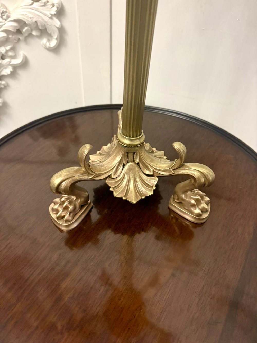 An antique Victorian gilt brass six-light candelabrum featuring a fluted central stem, acanthus leaf motifs, and paw feet. View VII