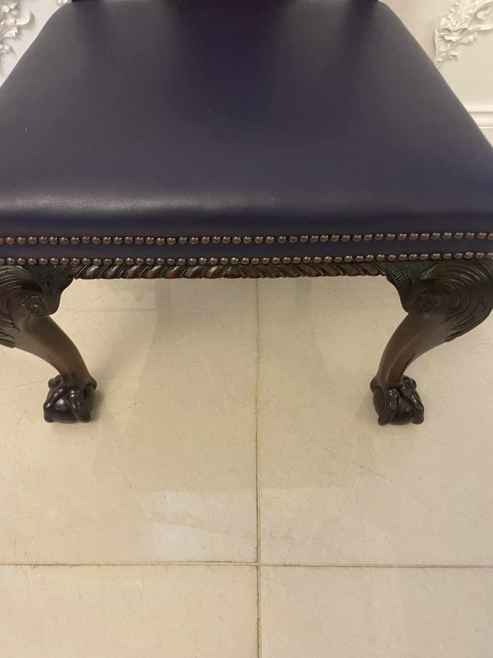 A set of carved mahogany dining chairs featuring pierced back splats, ball and claw feet, and purple leather seats. View X