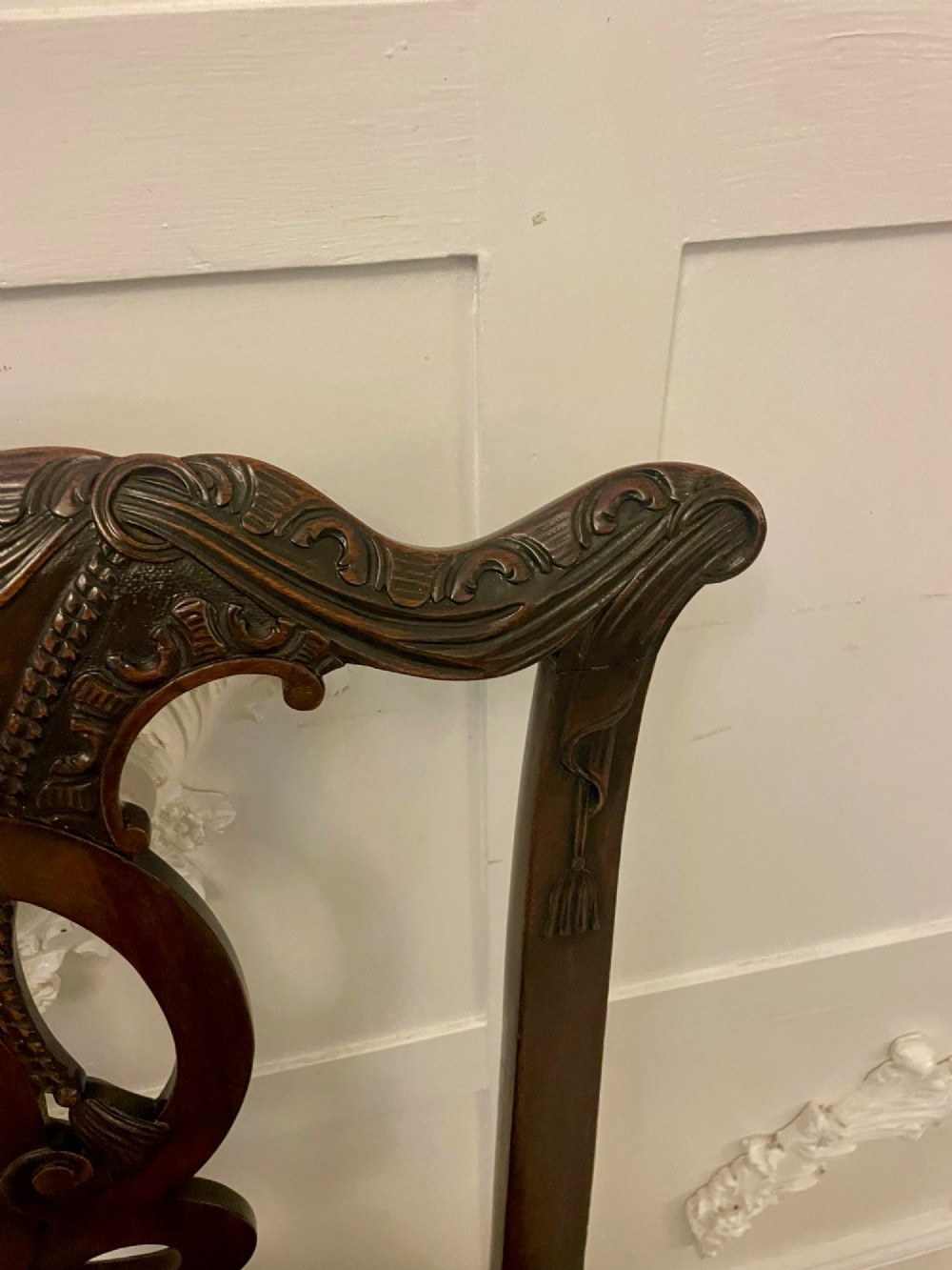 A set of carved mahogany dining chairs featuring pierced back splats, ball and claw feet, and purple leather seats. View XI