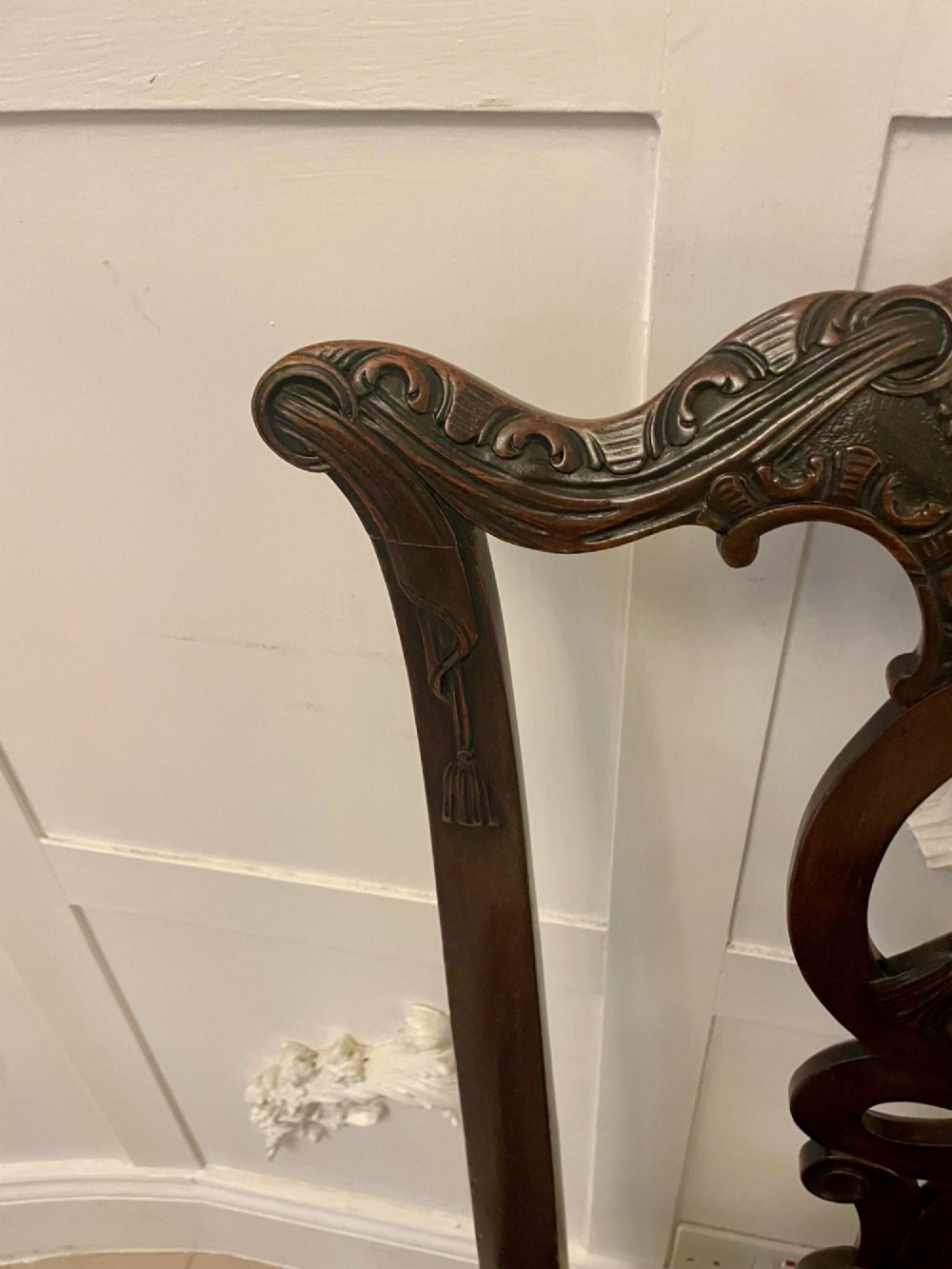 A set of carved mahogany dining chairs featuring pierced back splats, ball and claw feet, and purple leather seats. View XII